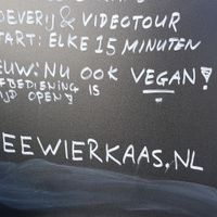 Close up of sign announcing vegan options  at De Vlielander Kaasbunker in Oost-vlieland