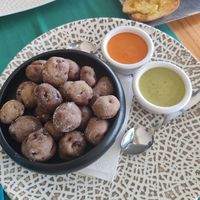 Papas arrugadas with mojo rojo and salsa verde at Jungle Vibes At The Marina (by Arabella) in Lanzarote