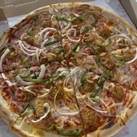 Vegan pizza with peppers, onions & spicy vegan sausagee  at Nicole's Pizza in Boston
