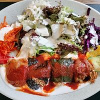 Verdure ripiene di riso speziato con salsa di pomodoro e insalata mista condita con abbondante salsa yogurt at Anatolia in Basel