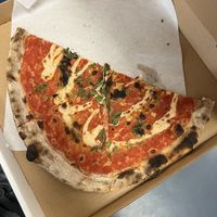 vegan pizza (half eaten)  at Pizza Casette in San Diego