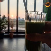 Fresh Juices with a sunset and sea view on the other side. Lovely restaurant with great ambience. Amazing fully vegan menu in which I ordered the Vegan cheese burger and some bague at Avec in Jeju