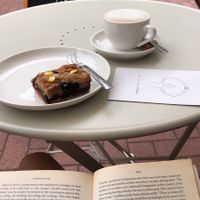 Blubbery cake and coffee with oat milk   at Omni - All Around Food in Groningen