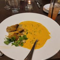 Coconut curry with tofu, strawberry rhubarb mocktail at Zeitgeist Restaurant & Bar in Duluth