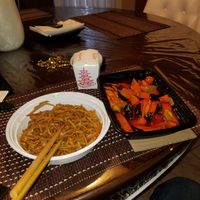 Pure City lo-mien, red ocean and broken rice in container. at Pure City in Pine Bush