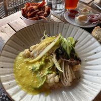 Grilled lettuce with coliflower puree and curry foam. at Surfers Lodge Restaurant in Ferrel