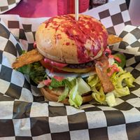 Brunch burger with LTO, just egg, umari bacon. Looks like a murder happened on it. Or someone got their period without planning for it. at The Dirty V in Raleigh