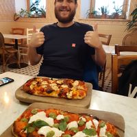 Incredible pizza. And my friend, who absolutely loves it here and is a frequent customer :D at Pizzeria Piccola in Ljubljana