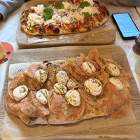 Morta vega and La citta in the background. Both delicious 👌 Best vegan cheese substitutes I’ve eaten in a long time. The vegan mortadela is also very tasty.   at Pizzeria Piccola in Ljubljana