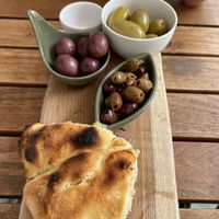 Starter of olive and bread (very accommodating, they made it vegan for us)  at Pizzeria Piccola in Ljubljana