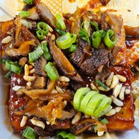 Fried Tofu Bites: garlic and tofu purée, soy-pickled shiitake, puffed rice.  at Lua Brewing in Des Moines