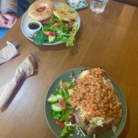 Jacket potato w/ cheese & beans (GF) and hummus & grilled pepper bagel  at Prosper in Ely