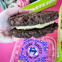 Double Chocolate Cookie Sandie with Cookie Dough Buttercream  at Cosmic Bakery  in Upland