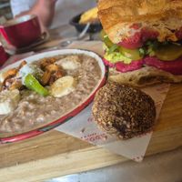 Vrunch: toast with beetroot hummus, pickles, arugula and avo (decent). Delicious porridge. Energy bal (not that great) at Adorado in Madrid
