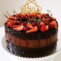 Vegan chocolate cake with chocolate mousse decorated with fresh berries  at Darchin in Dilijan
