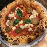 vegan margherita with extra vegan sausage   at Basils in Brussels