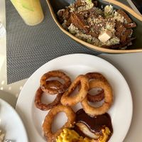 Poke bowl and onion rings  at H10 Costa Adeje Palace - Buffet Restaurant El Jable in Tenerife
