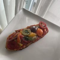 The tomatoes on toasted baguette   at Te Cor Gentil テコールジャンティー in Tokyo