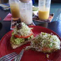 Avocado toast, two raw coffees, and a Hilo Sunrise smoothie. at Da Beans Green in Mountain View