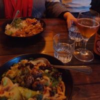 Ben ben noodles (front) & peanut butter curry (back) at SOIL Vegan Café - East in Amsterdam