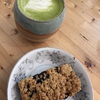Very good date square with an oat milk matcha latte.  at Parlabas café-boutique in Quebec