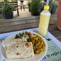 Chickpea curry with roti and juice  at Flames Kitchen in St James