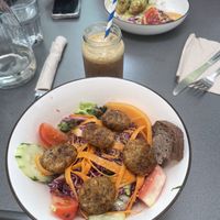 Green bowl with flagged and iced coffee   at Ma Pause Bio in Narbonne