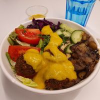 Falafel hummus bowl with mango kurkuma sauce at Csicseri Gozsdu in Budapest