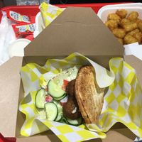 Meatball sandwich and tater tots. at Vegan Grill - Upper East Side in New York City