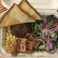 Breakfast: tofu scramble, bac'n, saus'ge, salad, and toast. at Vegan Grill - Upper East Side in New York City