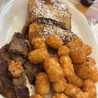 French toast with beyond sausage patty, tater tots   at Vegan Grill - Upper East Side in New York City