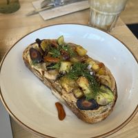 Roasted veggie toast with potatoes, rainbow carrots, zucchini, and dill.  at Bake Shop in Seattle