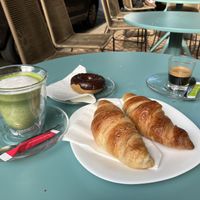 Matcha latte, espresso, croissant and a chocolate donut.  at Fraise Café in Menton