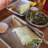 We housed the delicious vegan burger and yucca fries before I remembered to take a picture. Sorry. Pic shows the wrap and huge dish of collards.  at Farm Fresh Fast in Simpsonville