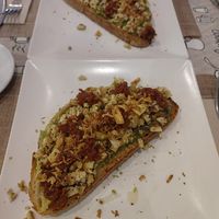 Tostada de revuelto de tofu, aguacate, cebolla frita, albahaca y tomates cherrys deshidratados at VEGandVEG Gastroartesanía in Fuenteheridos