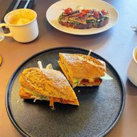 bahn mi and mushroom toast in the background   at Beyla in Copenhagen