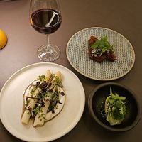 Asaragus over creme fraiche & gochujang wings with a cucumber lime side to balance heat at Beyla in Copenhagen