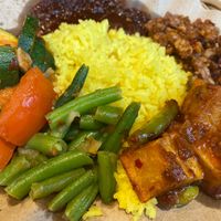 Nasi kuning with various vegan toppings   at Gembira in Maastricht