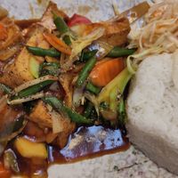 Item 80: fried tofu with vegetables in chop suey sauce; served with rice and a small cabbage salad at Asia Sushi Bar in Rathenow