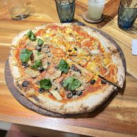Half and half the two vegan pizzas  at Gorgonzola Pizza & Pasta - El Nido in El Nido
