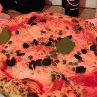 Pizza with olives and capers at Donna Mamma in Budapest