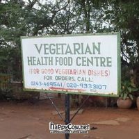 The sign for it off the road, keep an eye out for it! at Pat's Vegetarian Health Food Center in Accra