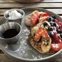 Pancakes with berries, orange syrup and vegan whipped cream  at HOB in South West London