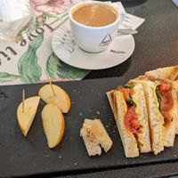The full menu was not available until noon, but this was quite nice. Vegan "toast": toasted sandwich cut in fourths with vegan butter and cheese, cherry tomatoes, and done manner o at O Secreta in Machico