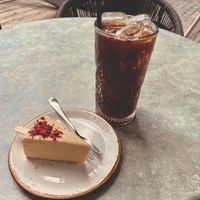 a vegan cheese cake covered with white chocolate at Moltto Coffee in Riga