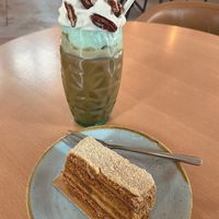 a lotus cake and a coffee-caramel-hazelnut-pecan drink with veg cream at Moltto Coffee in Riga