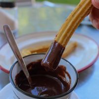 Churros with chocolate with almond milk at Churrería La Gloria in Gijon