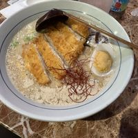 black garlic ramen with a vegan egg and a ramune in the back  at 7' Yen Sushi in Roseville