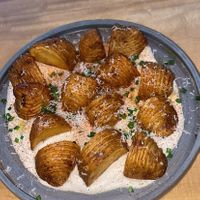 Potatoes with a “cheesy” sauce  at Real Vegetal in Medellin