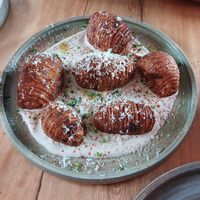 Papas con queso crema de ajo negro, 10/10 at Real Vegetal in Medellin